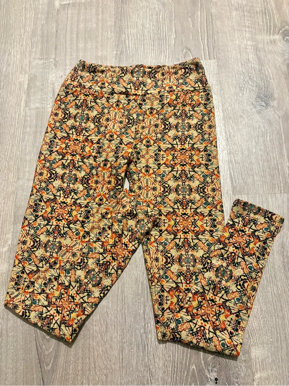 LuLaRoe Multicolor Geometric Print Leggings in Cream, Orange, Black & Teal
